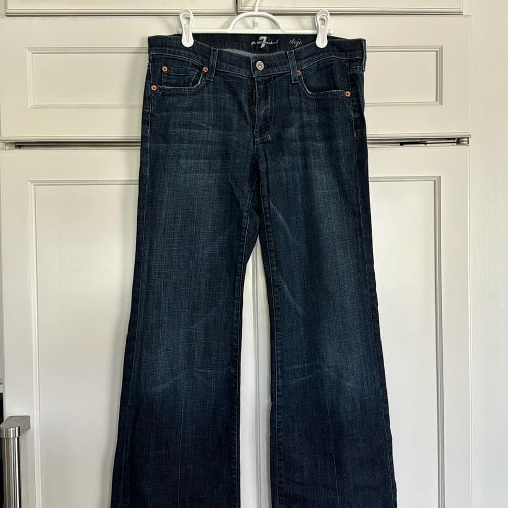 Seven jeans, size 31, some fraying on the bottom as shown in photo. Wide leg.